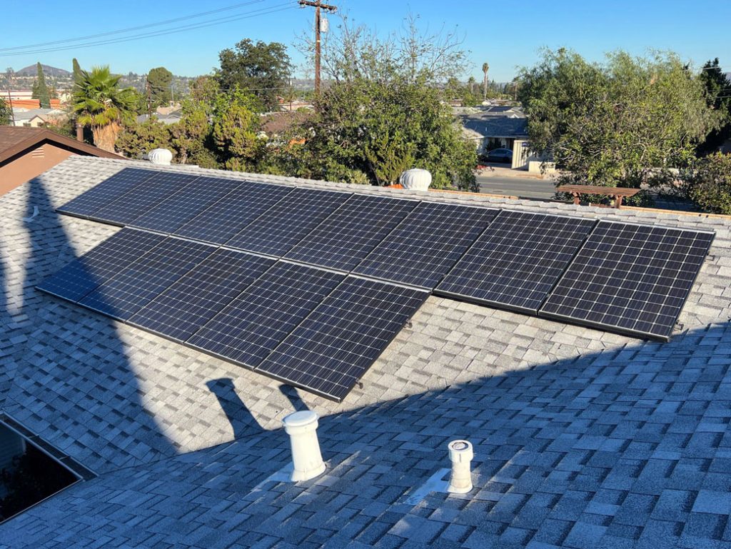 Rooftop solar panels installed on a sloped roof in La Mesa, showcasing a clean energy solution for homeowners to reduce electricity costs and enhance property value.