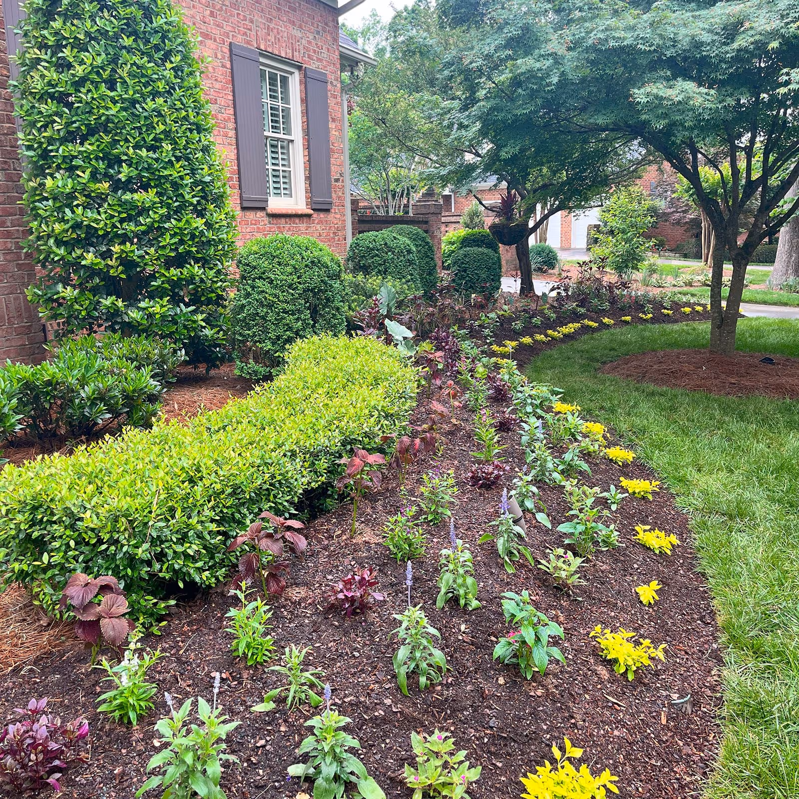 Rock and mulch install for residential property by Magnolia Outdoor Services