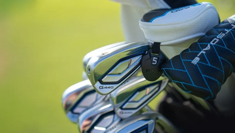 PING G440 Irons in a club bag with a golf course in the background 