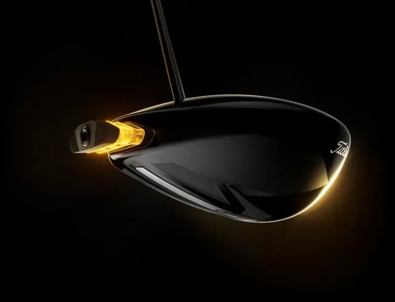 close-up of the Titleist GT1 Driver clubface on a black background, outlined with soft yellow highlights.