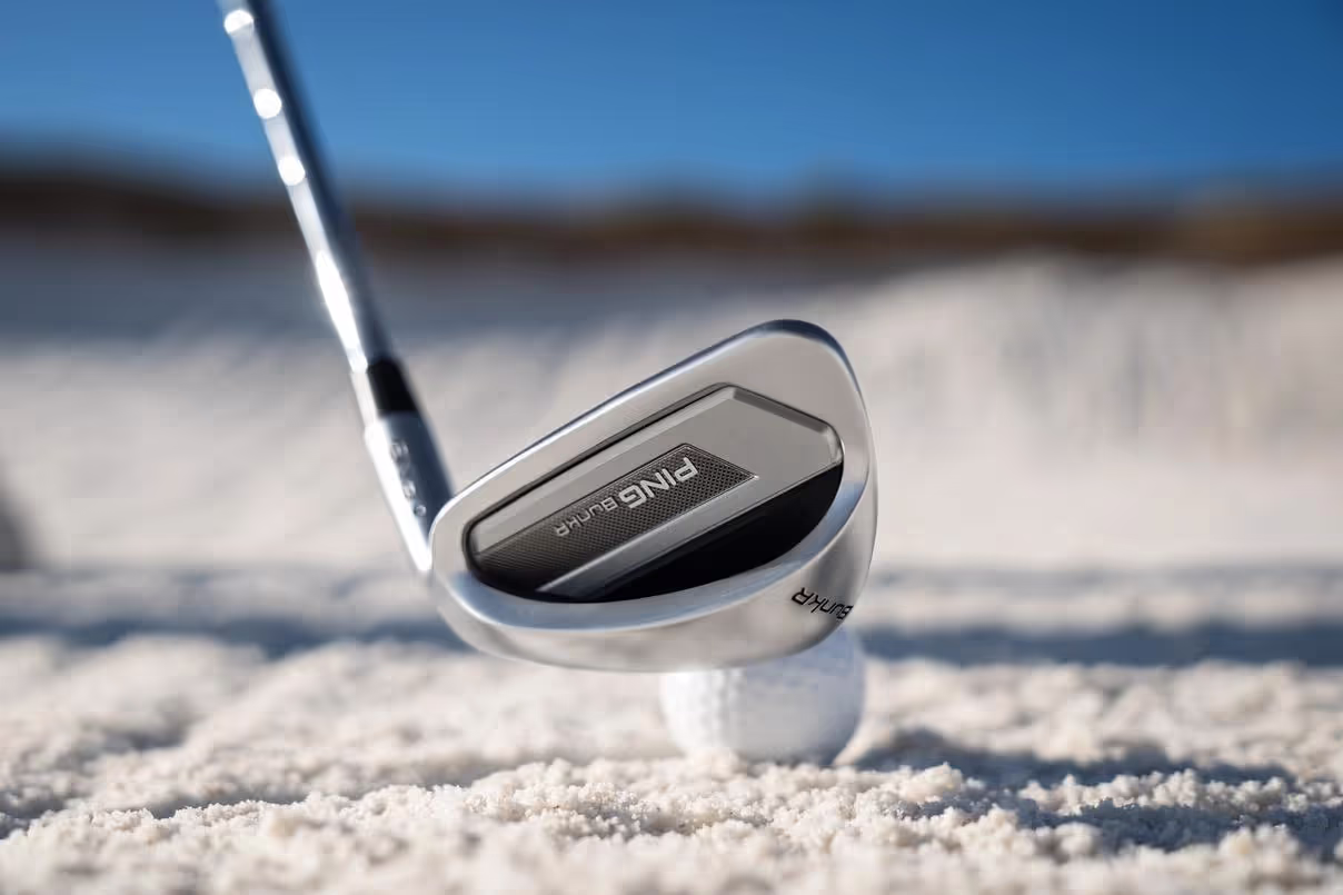 Back view of a PING BunkR Sand Wedge lined up to hit a bunker shot.