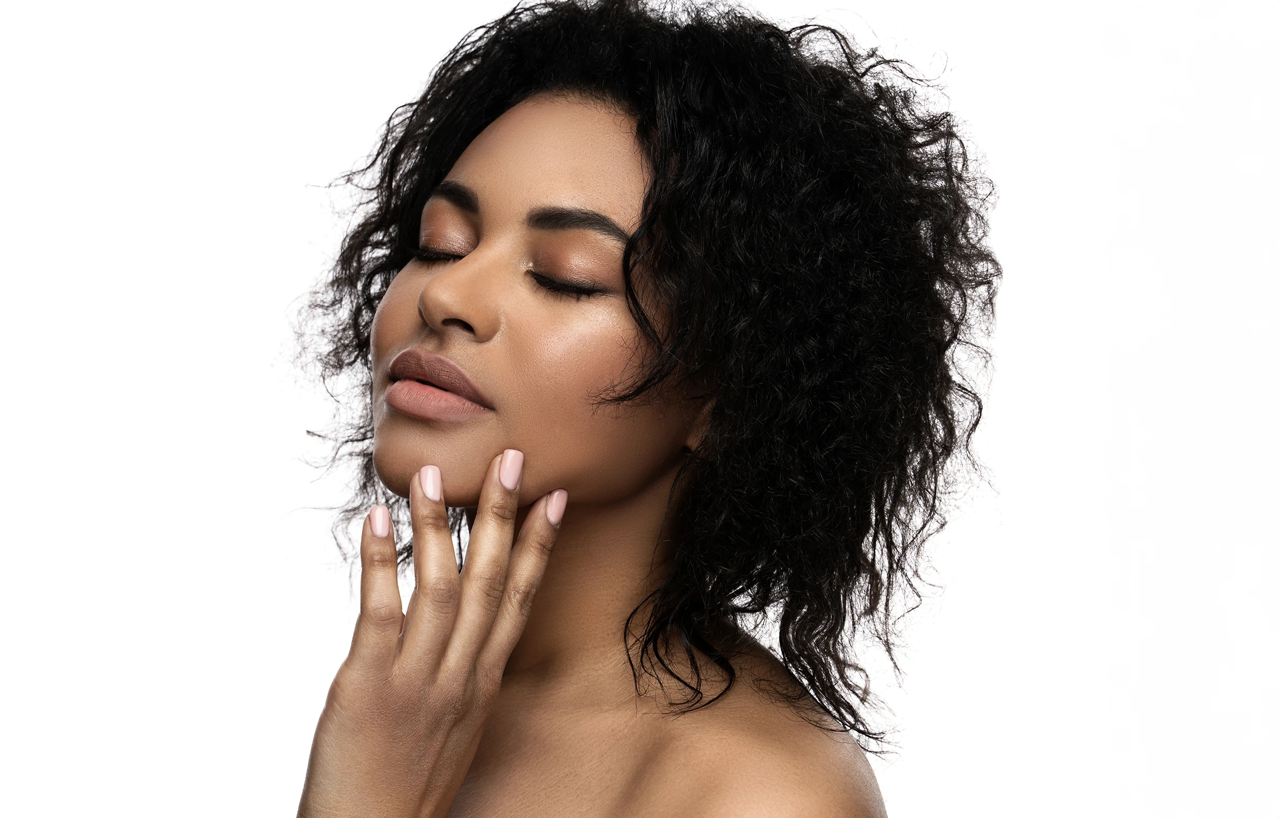 A woman with her hands on her face.
