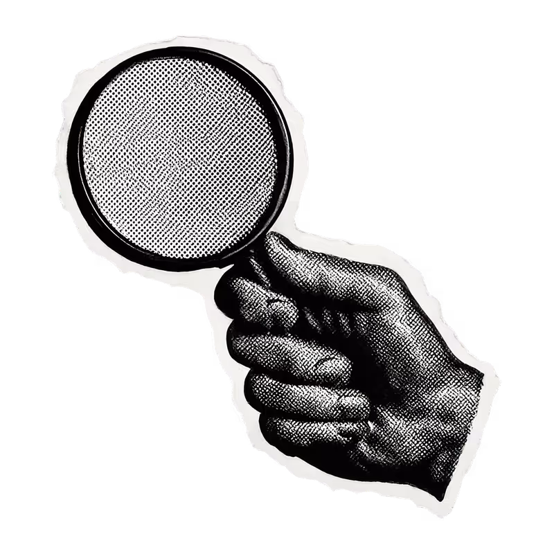 A hand holding magnifying glass