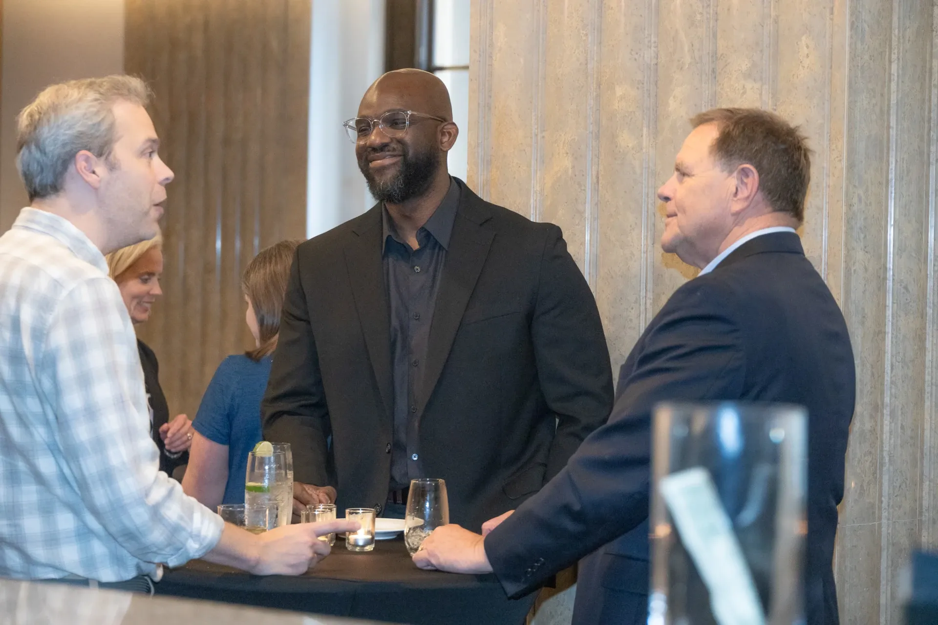 branches members around a table talking