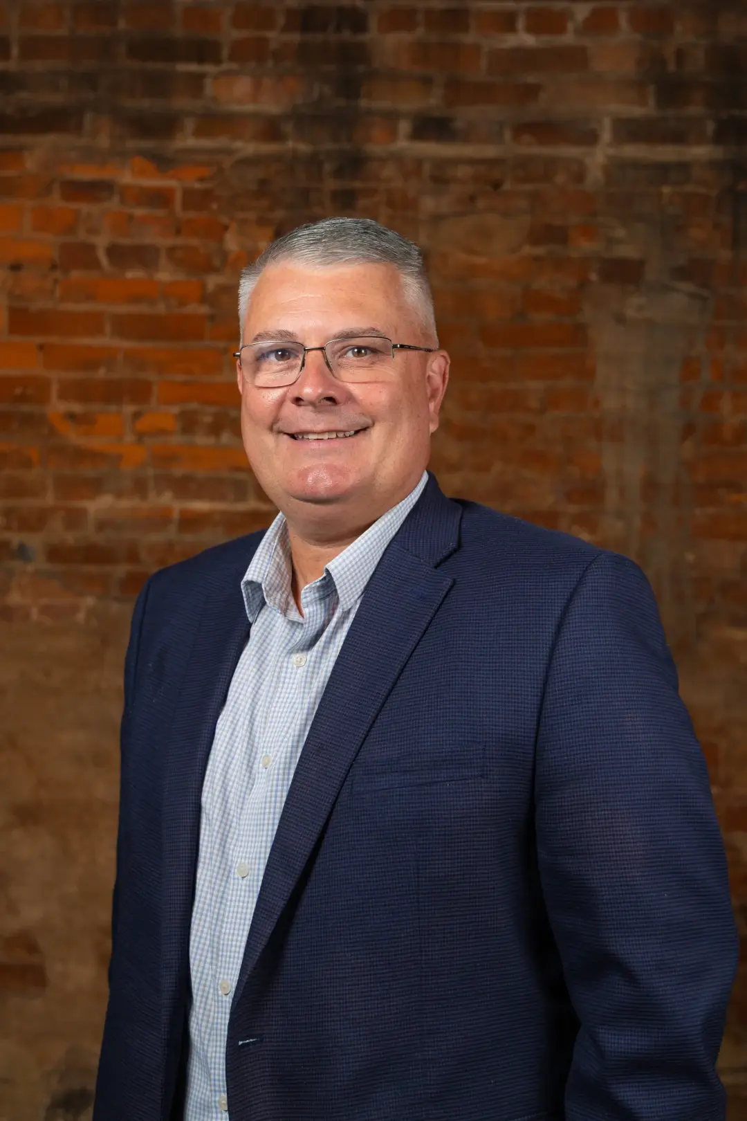 kevin headshot brick wall