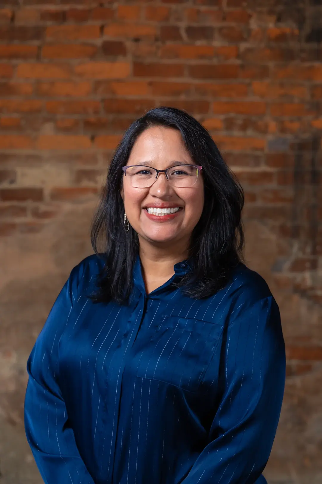 narrly headshot brick wall