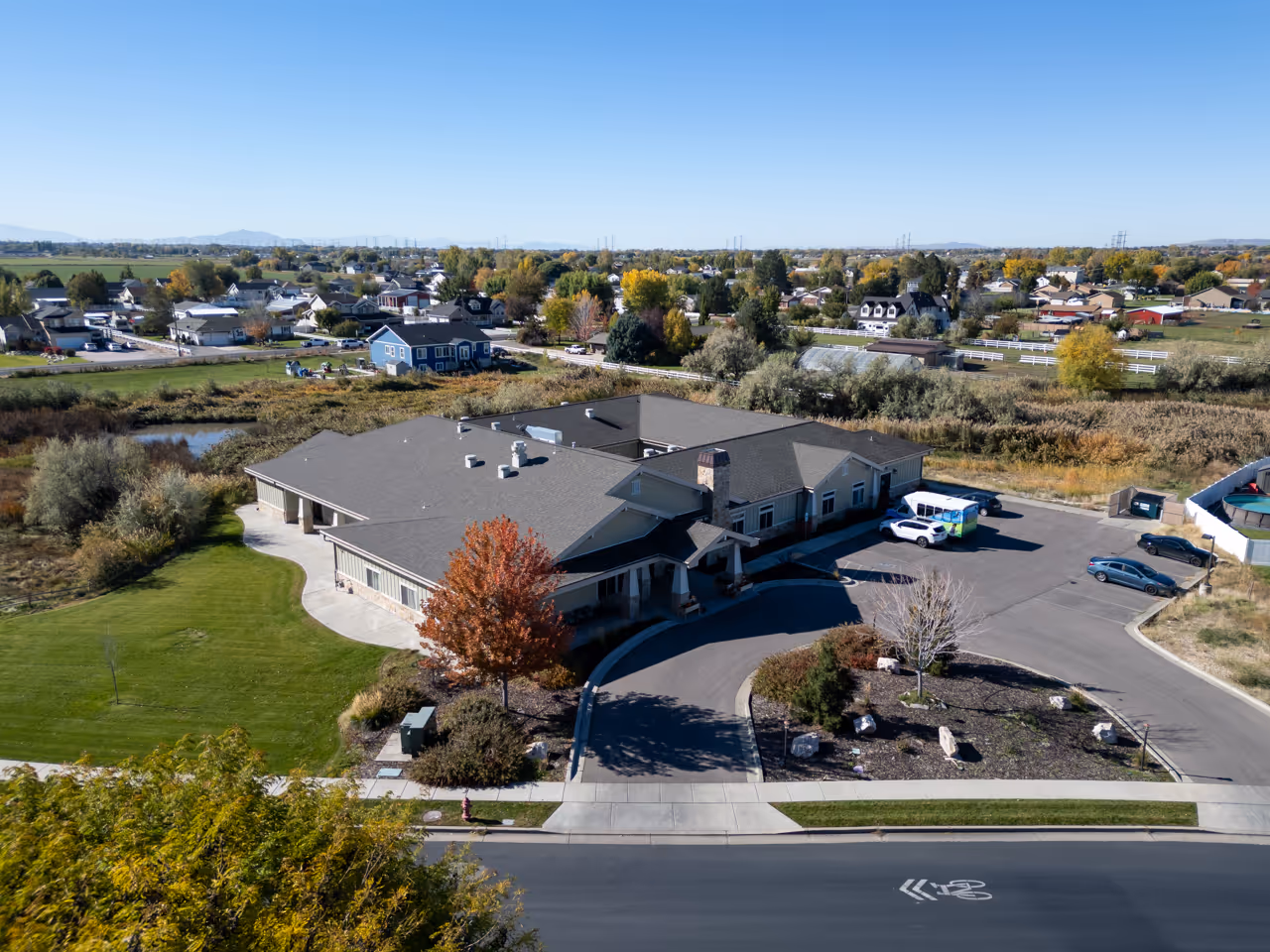 beautiful ariel shot of seasons assisted living in farr west utah on a blue sky day