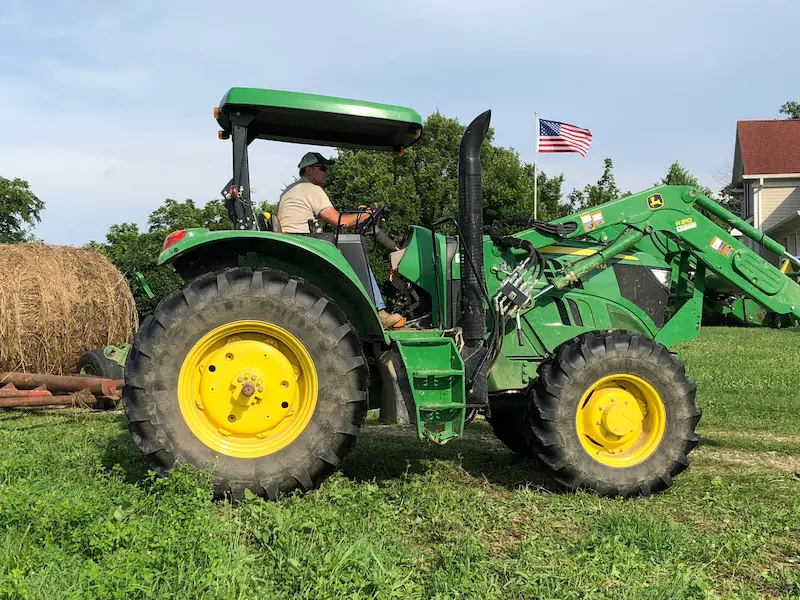 ed gallrein driving a tractor