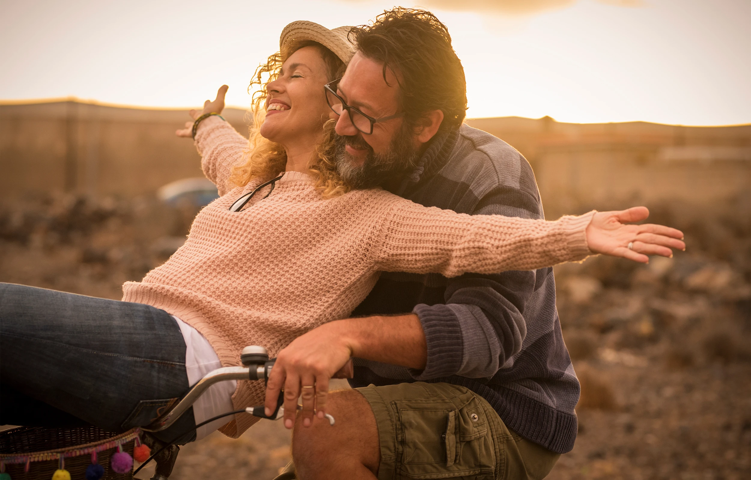A couple riding a bike