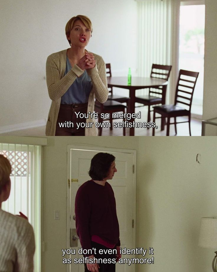 This may contain: two women standing in front of a door talking to each other