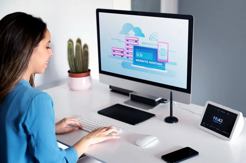Woman sitting at a desk with computer