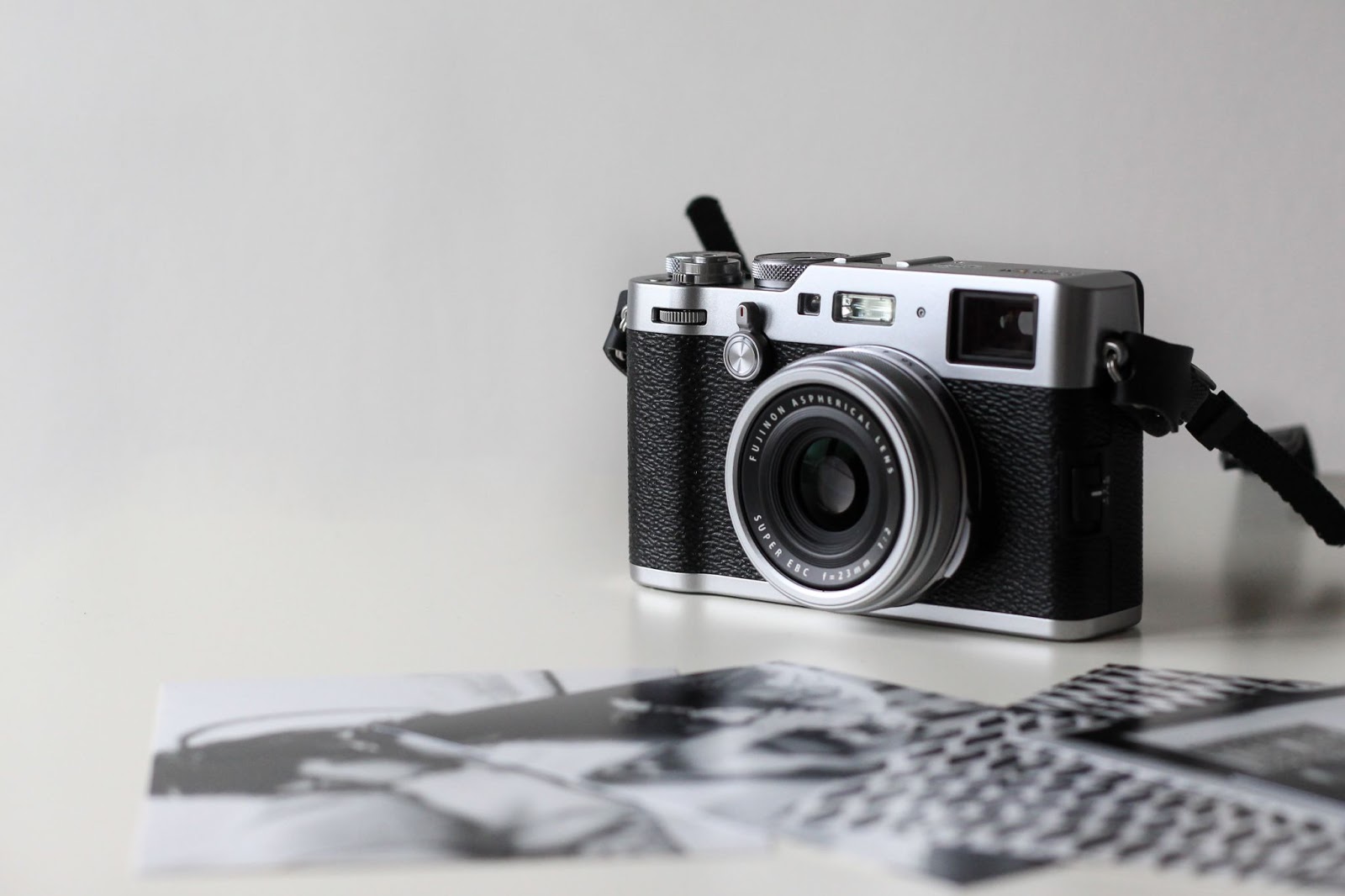An image of a film camera, set on a gray background.