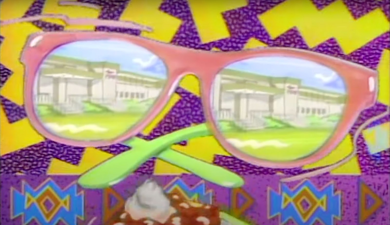 Still from Saved By The Bell intro, purple background with yellow zig zags.Large pink sunglasses with the reflection of a high school in the lenses.