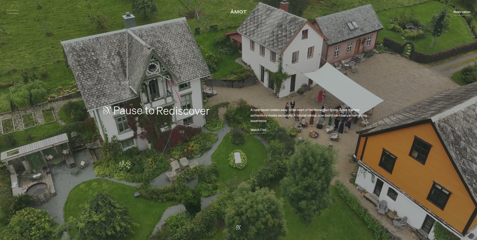 The Åmot homepage overlays the headline “Pause to Rediscover” on a video showing off the property from above.