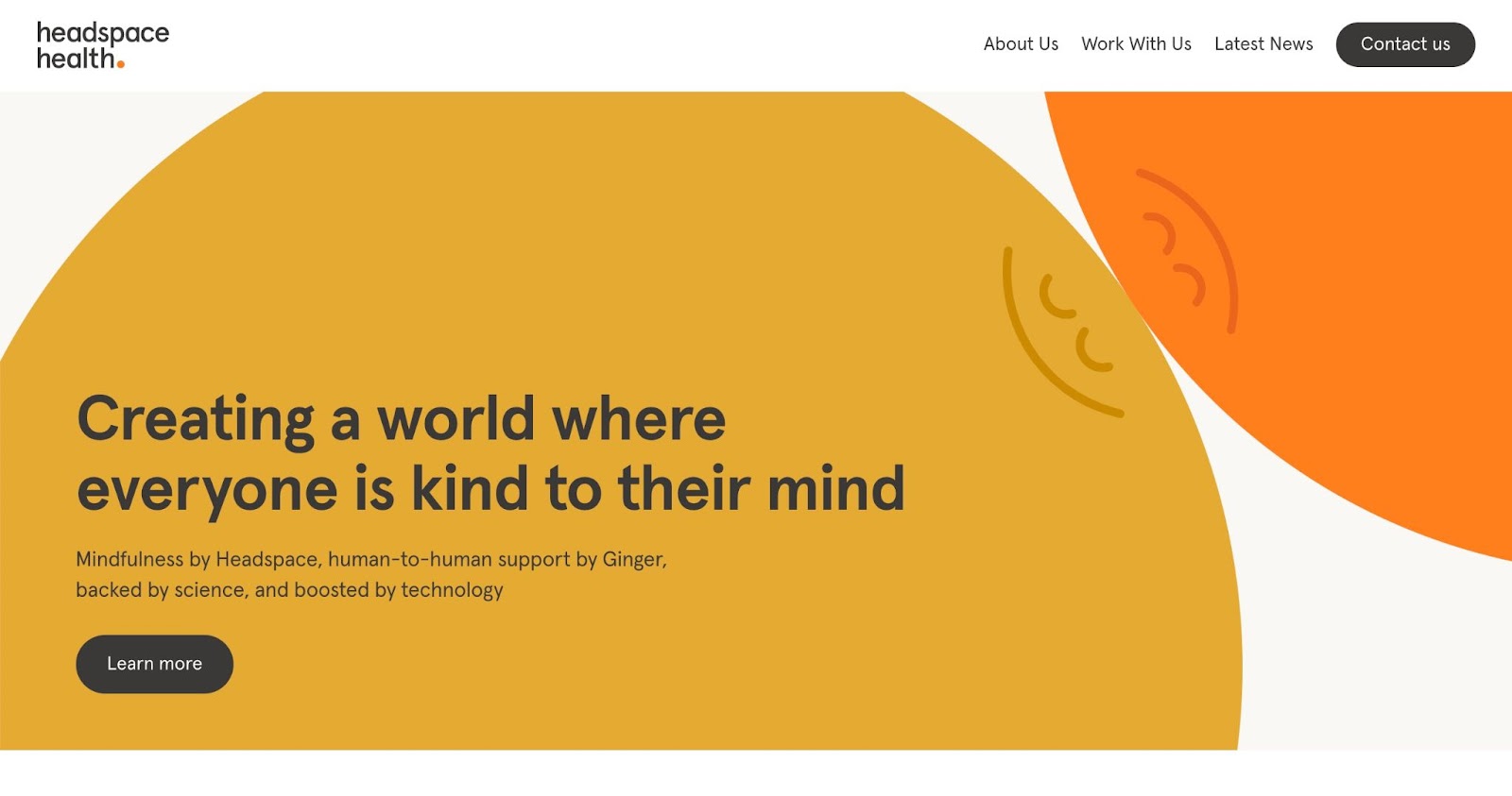 The Headspace Health homepage featuring a large dark, yellow circle in the center touching a cut-off portion of an orange circle at the top-right corner. The yellow circle houses the headline text of "Creating a world where everyone is kind to their mind."
