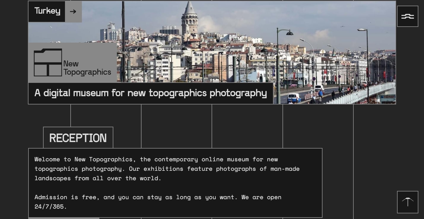 The New Topographics website. It utilizes dark gray, black and white with sparse lines. 