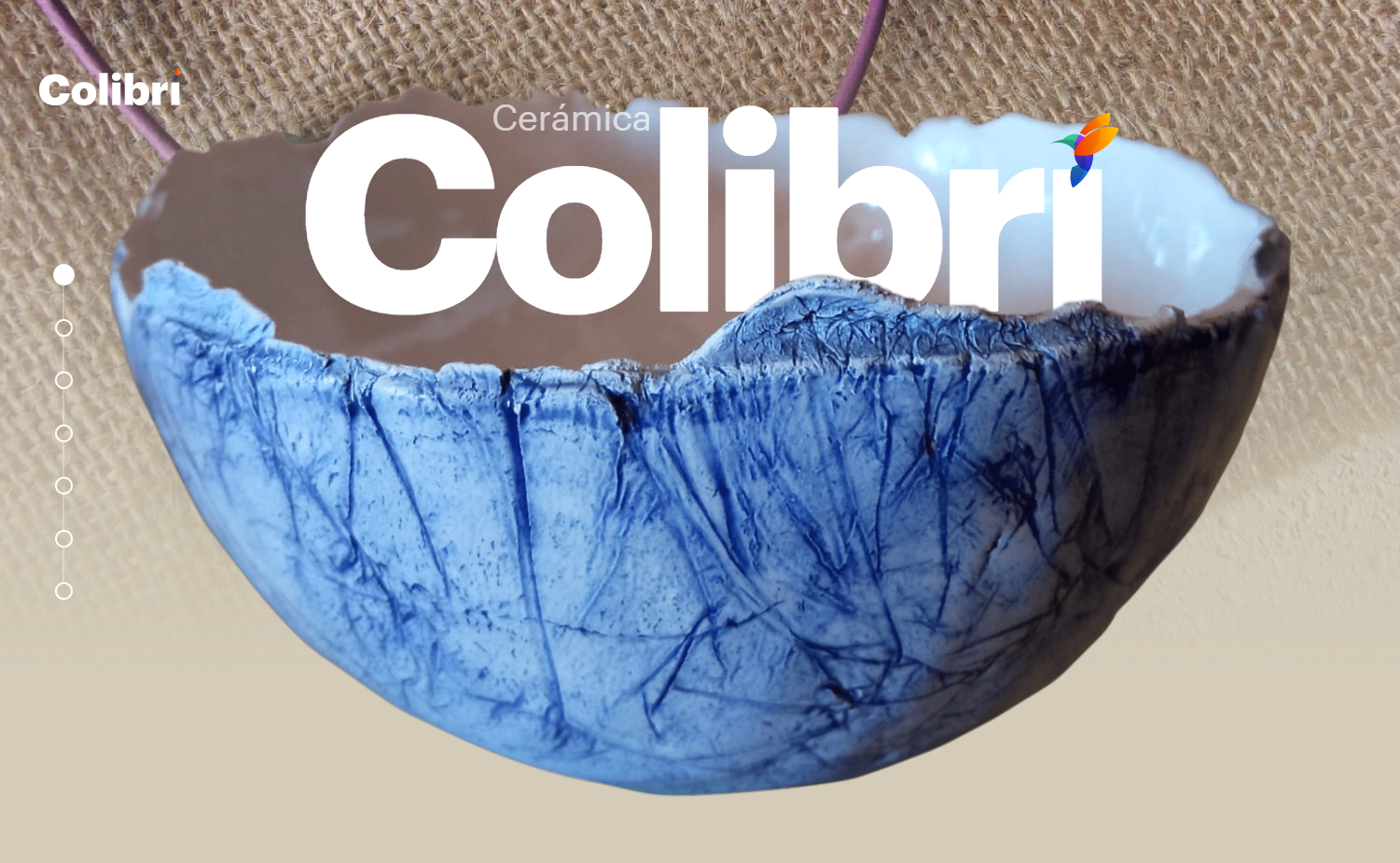 Website showing the large white text “Colibri” being swallowed by a blue-and-white ceramic bowl.