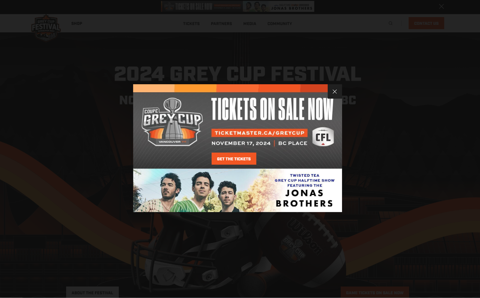 A pop-up from the Grey Cup Festival website that starts with a headline that reads, “Tickets on sale now” in all caps. A CTA button appears near the center that reads “Get the tickets” in all caps.