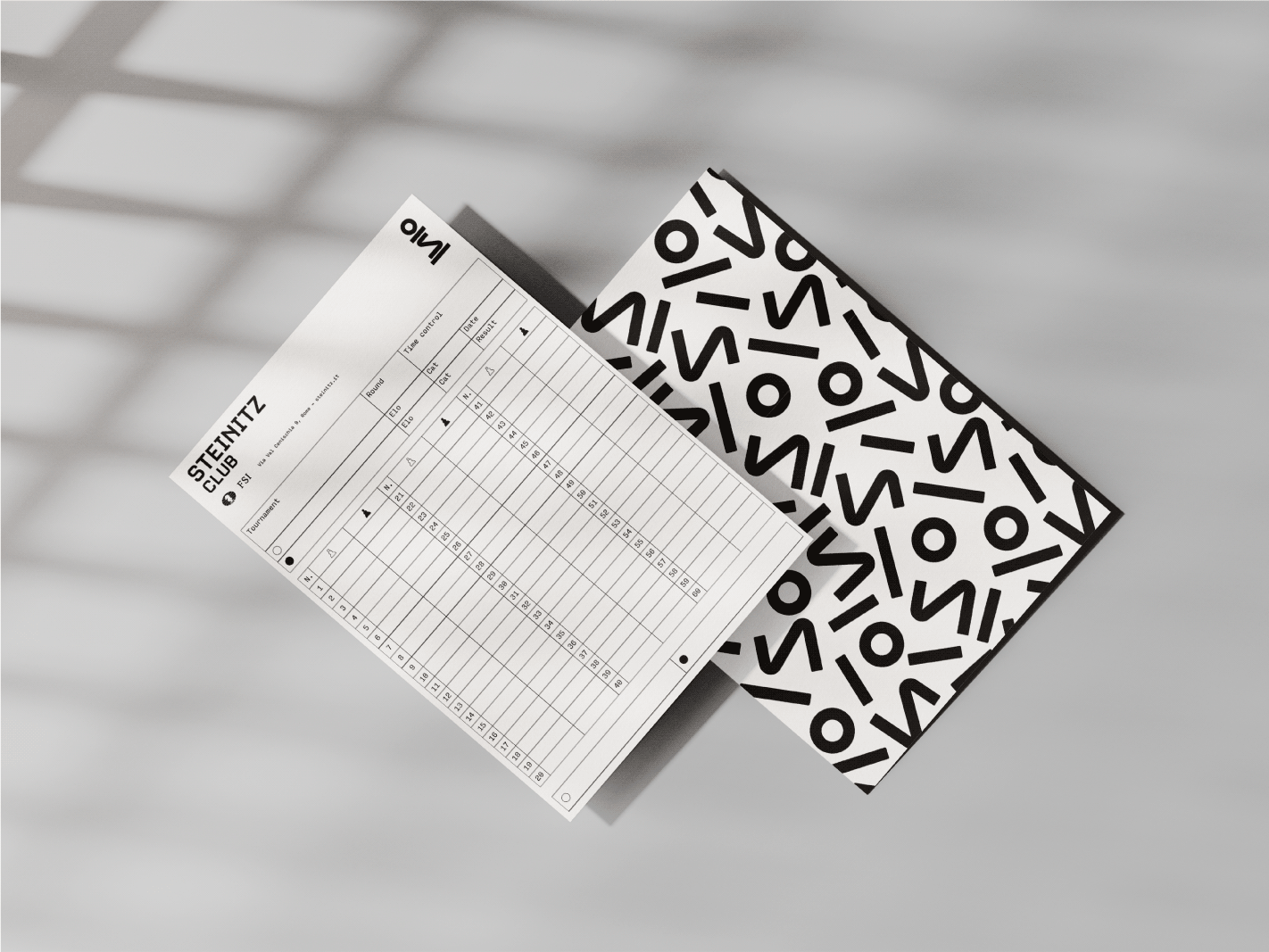 An image of Steinitz Chess Club’s branding on a chess score sheet in black and white.