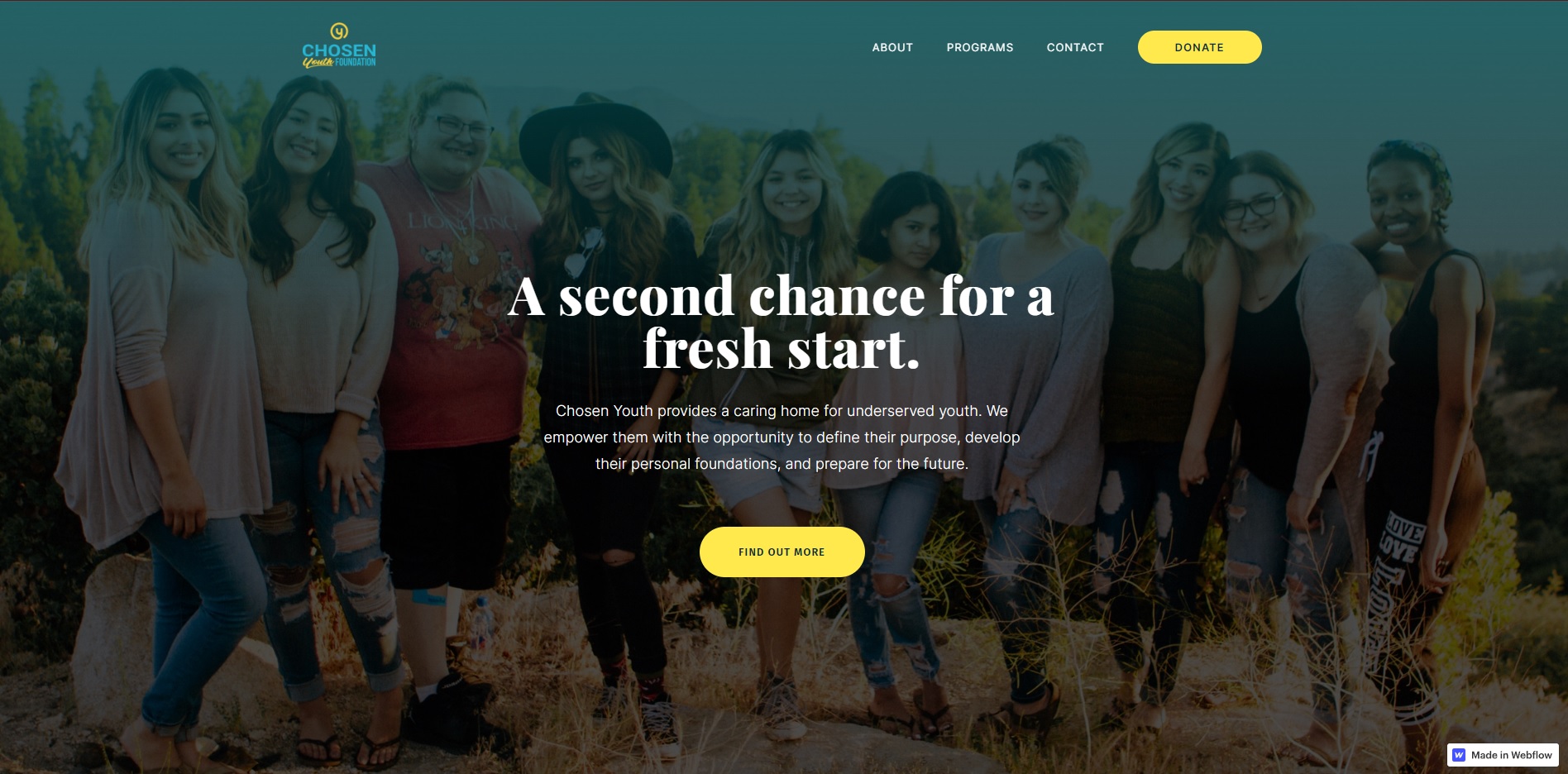 A screenshot of Chosen Youth’s desktop site, with text that reads “A second chance for a fresh start” over a faded photo of happy teens in a field.