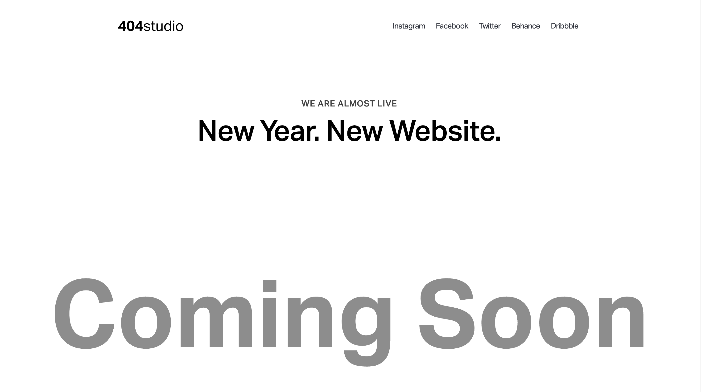 The 404studio landing page has a plain background with the headline “Coming Soon” in bold letters in the center.