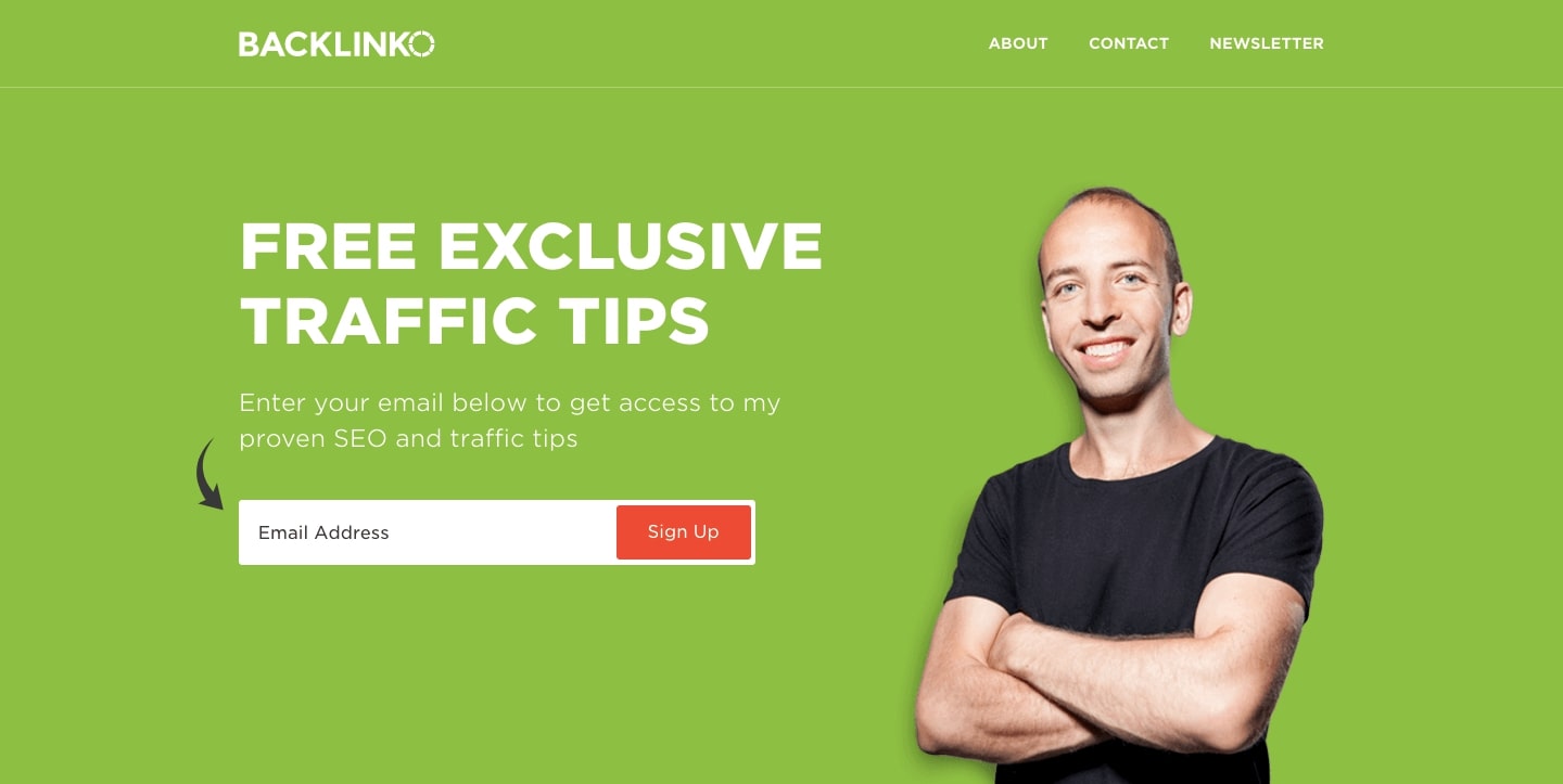 Backlinko homepage. Green background, white text "Free exclusive traffic tips" next to photo of Brian in black t-shirt