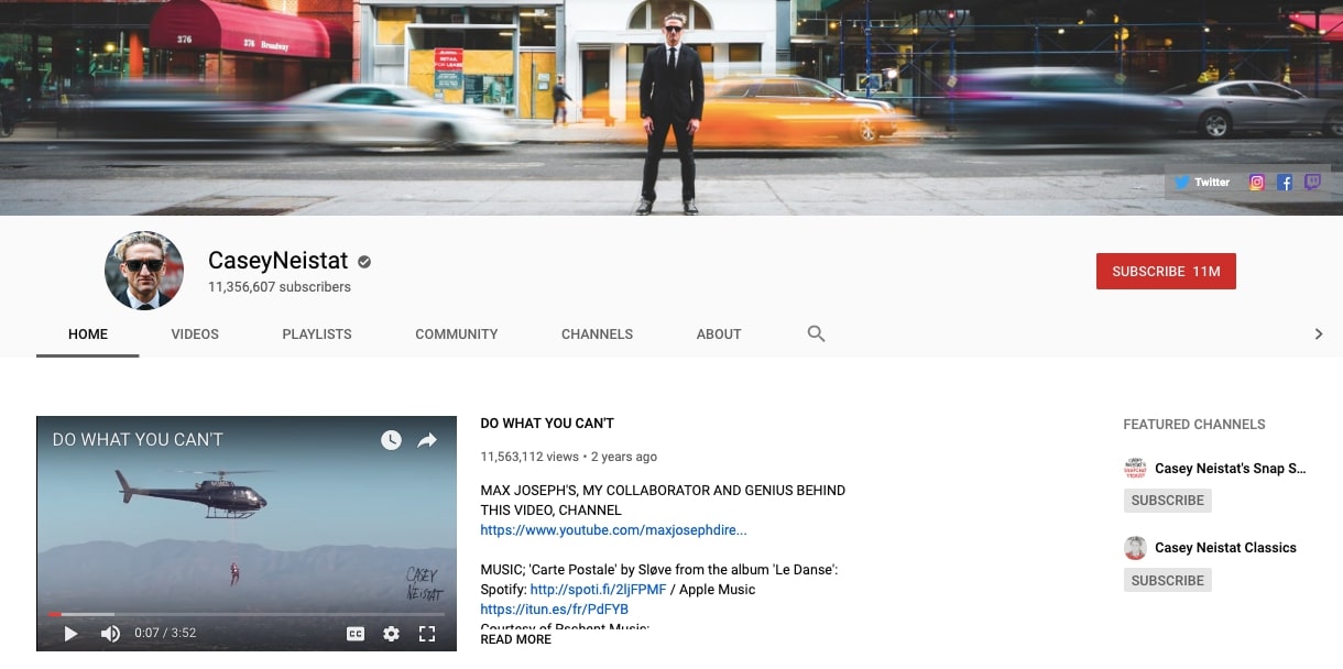 Casey Neistat YouTube page. Channel photo of Casey in black suit and sunglasses standing in front of blurred cars.
