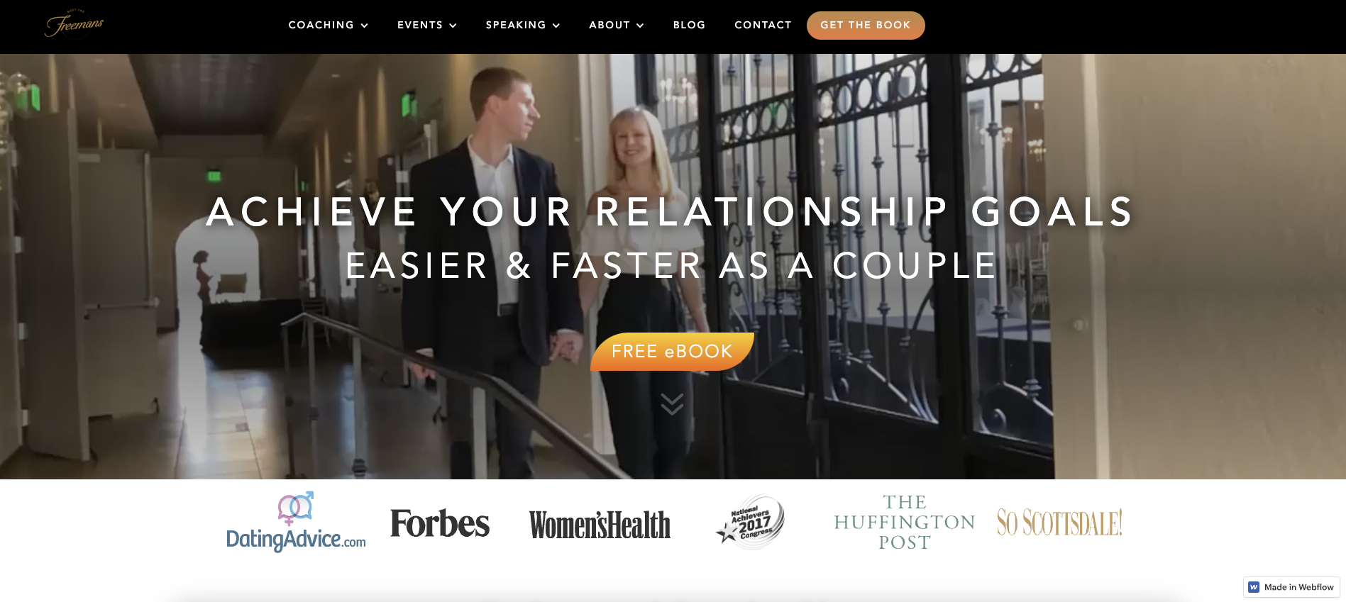 A screenshot of The Freemans’ website, with a menu and the text “ACHIEVE YOUR RELATIONSHIP GOALS EASIER & FASTER AS A COUPLE” in bold white letters against a background image of Jocelyn and Aaron Freeman.