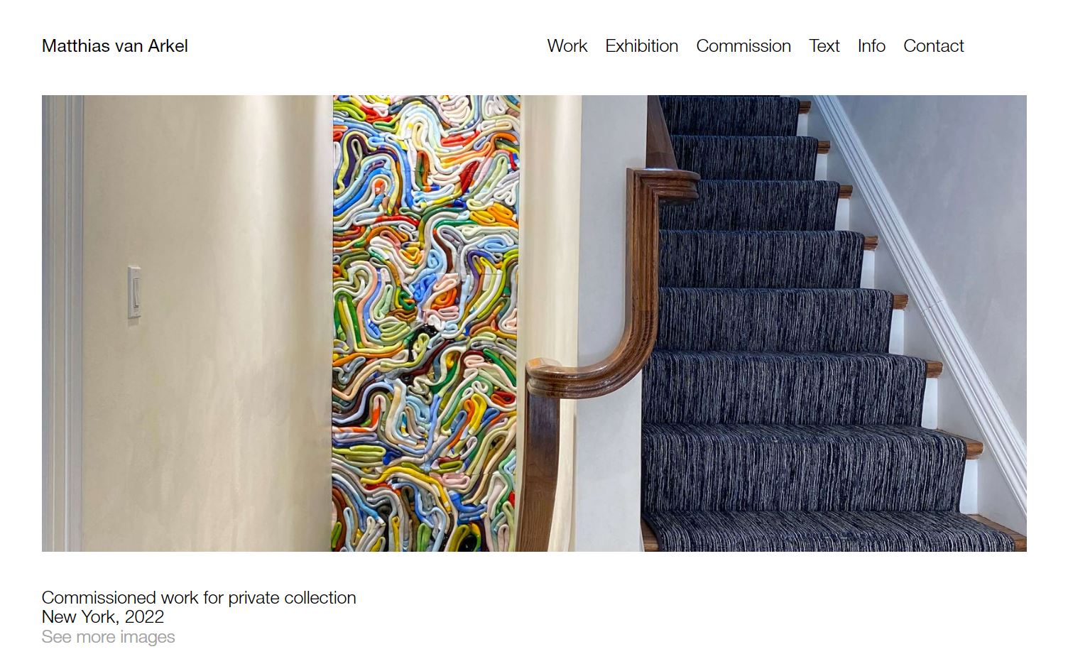 A photo of a colorful, textured artwork beside an interior flight of stairs.