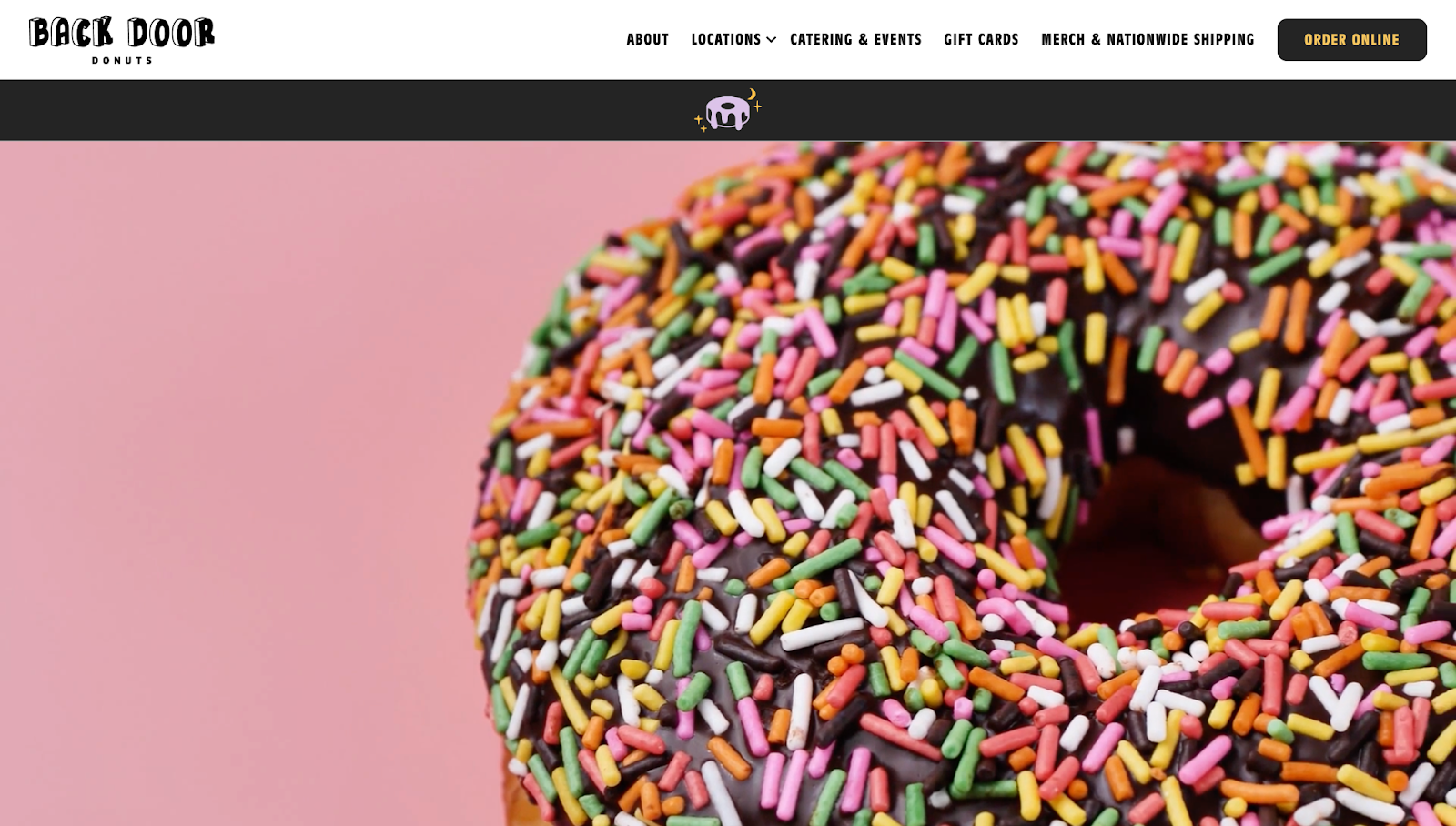 Back Door Donuts’ website has the company logo in the top-left corner, the menu aligned to the right, and a looping video below.