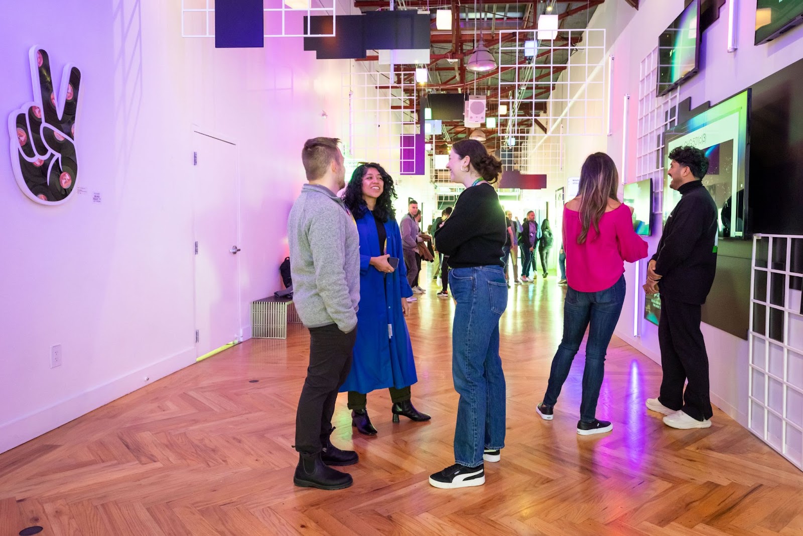 An image of attendees standing and talking at Webflow Conf 2022.