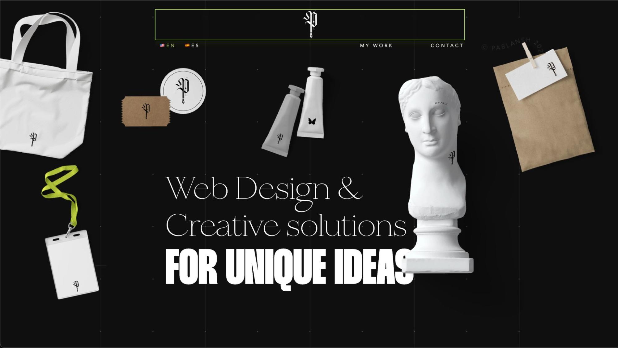 Pablansh homepage. Black bsckground. text "Web design & creative solutions for unique ideas" surrounding by floating 3D objects (tote bag, paint tubes, lanyard, bust)