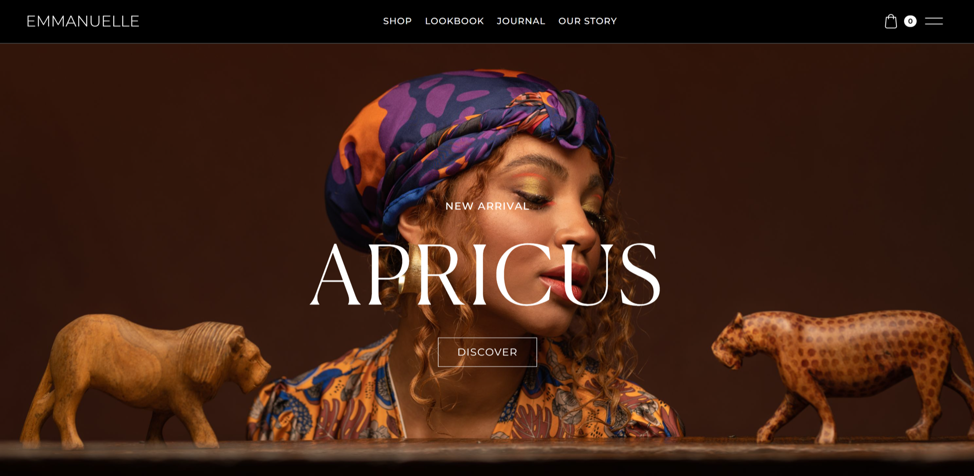 A screenshot of Emmanuelle’s home page, featuring dominant brown tones, a black navigation bar, and a high-quality header.