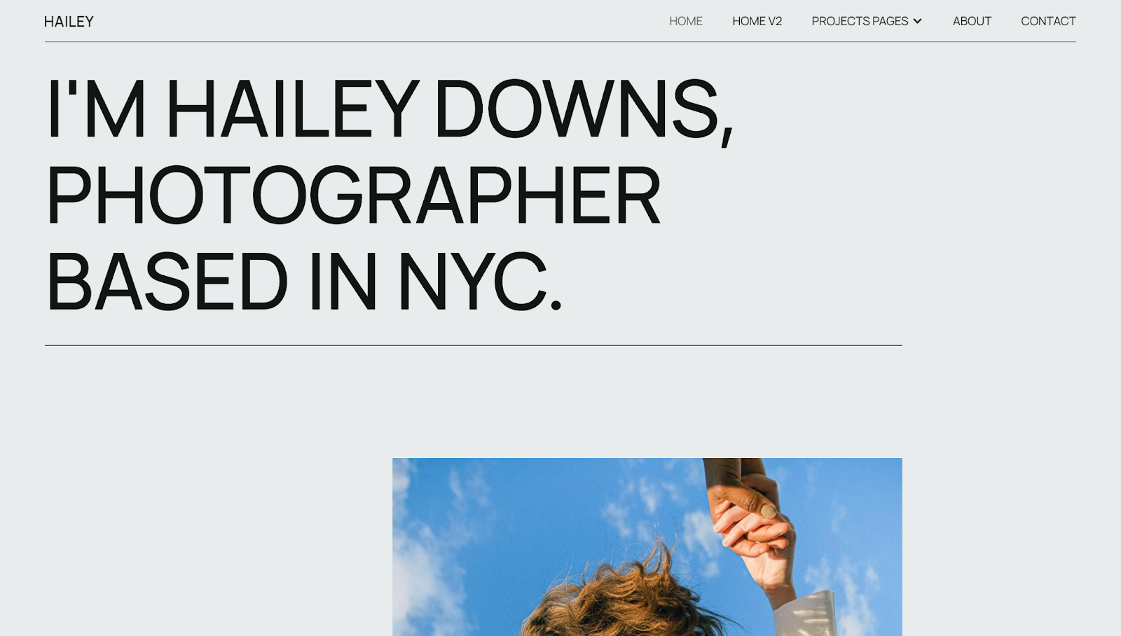 The Hailey photography website template has a website header with the text “I’m Hailey Downs, Photographer Based in NYC.” against a gray background.