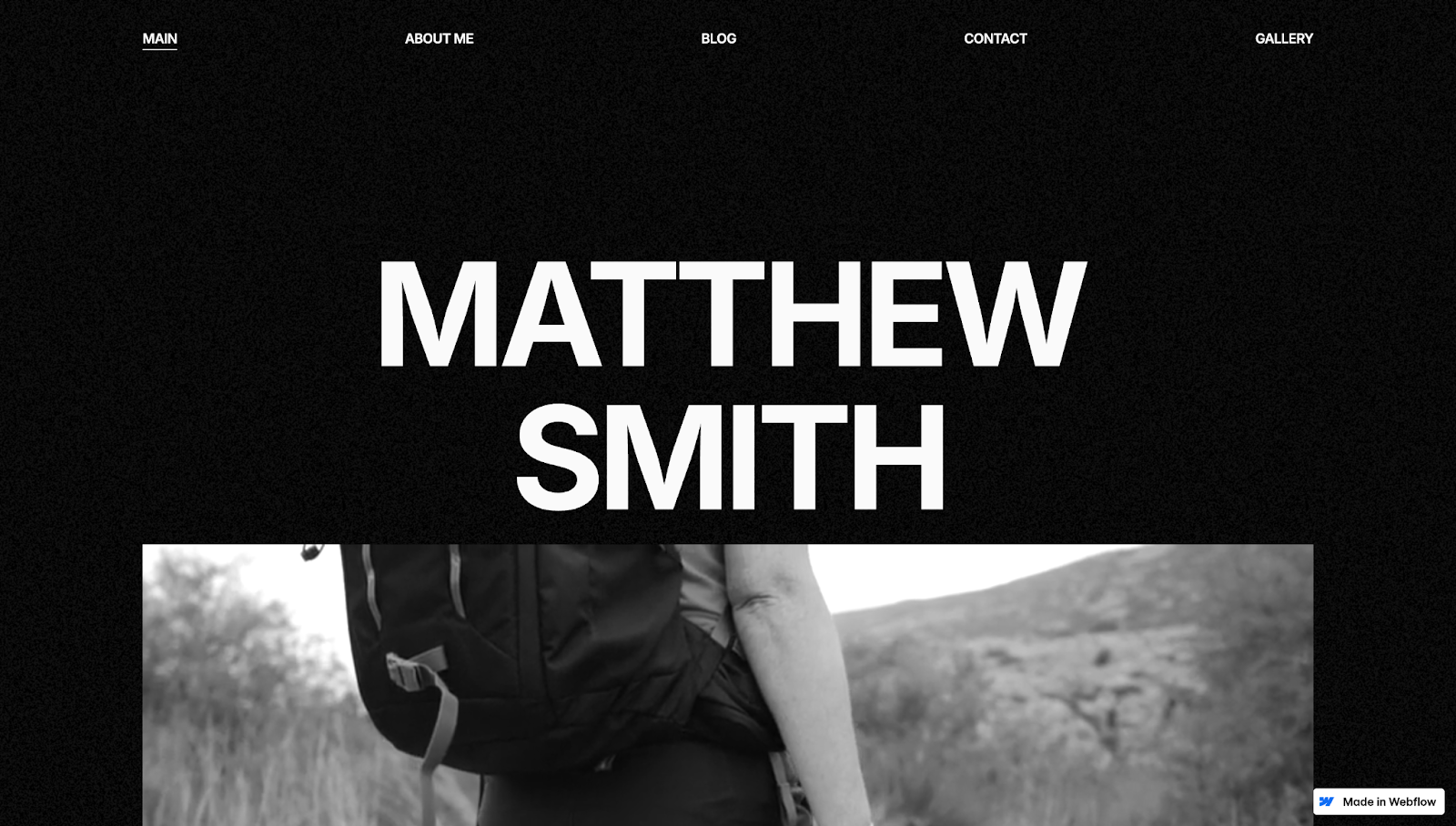 The Visionary DB photography website template has a monochromatic theme with a menu at the top, the text “Matthew Smith,” and a thumbnail on a black background.