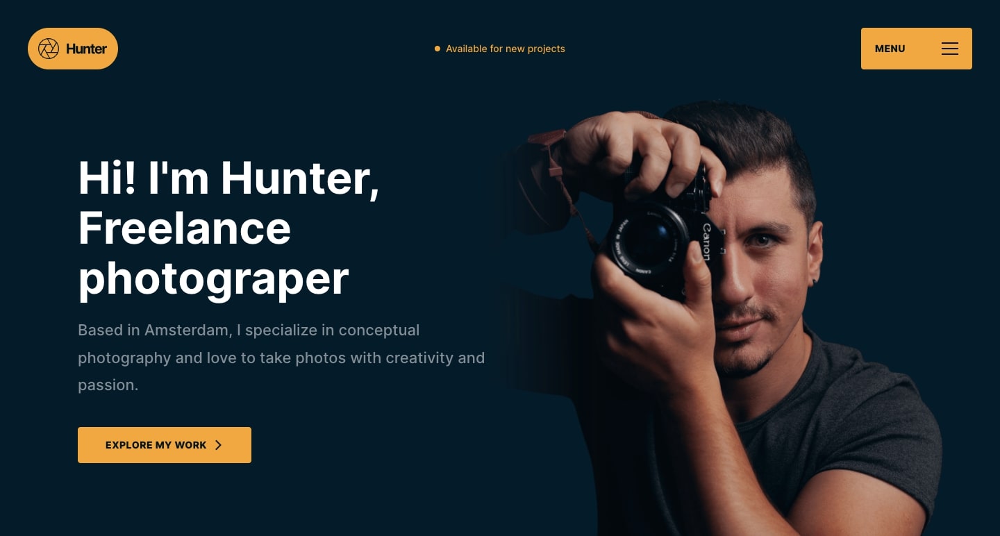 Hunter homepage. Dark navy background with white and golden yellow text. Right side, photo of a man holding a camera to his eye.