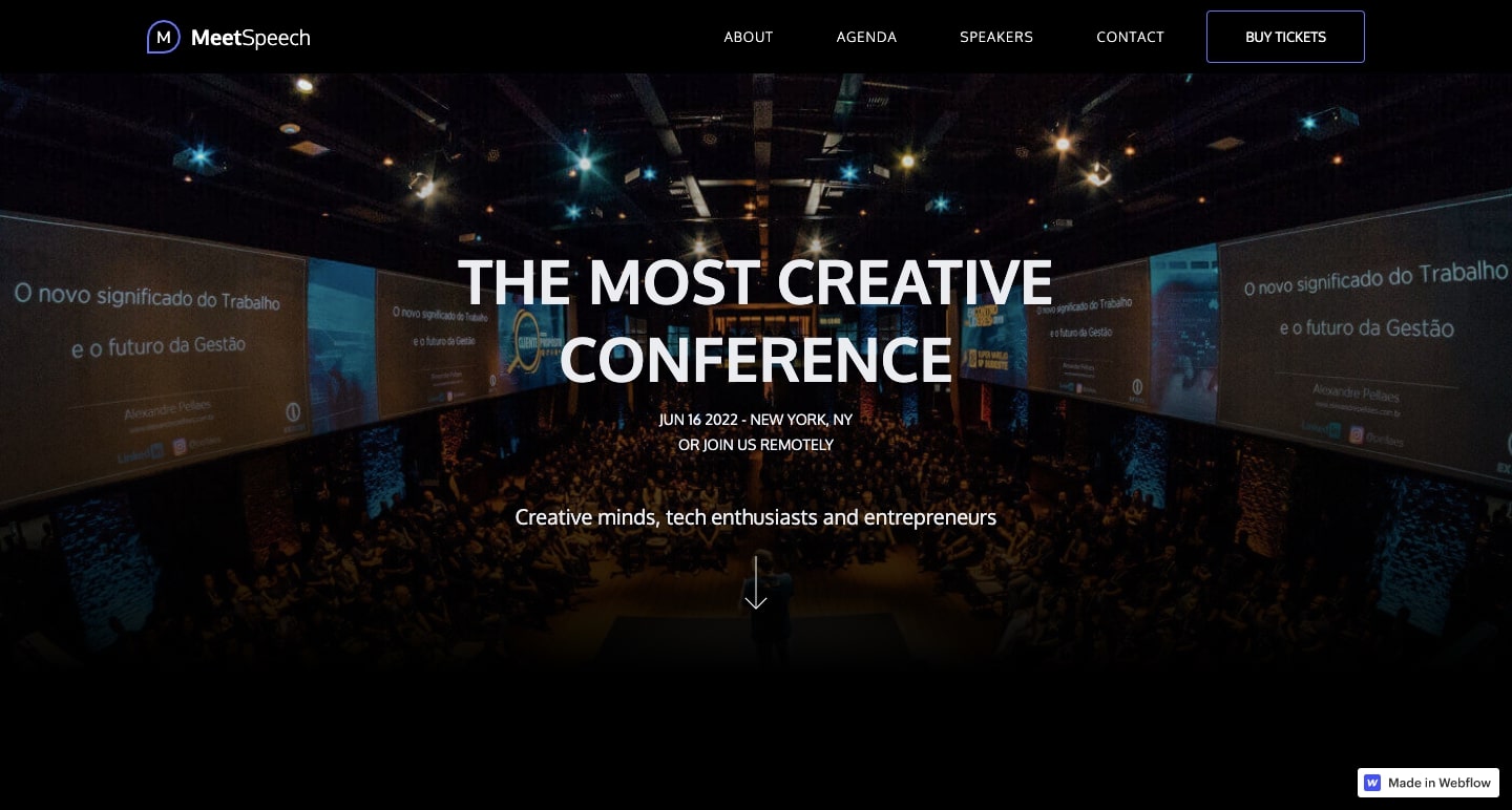 MeetSpeech template showing a large conference center with huge screens on the walls and a large crowd of people. White text "the most creative conference."