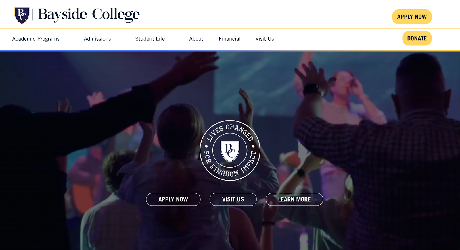 A screenshot of a website featuring a fullscreen image of a college event with graphic designs and CTA buttons.