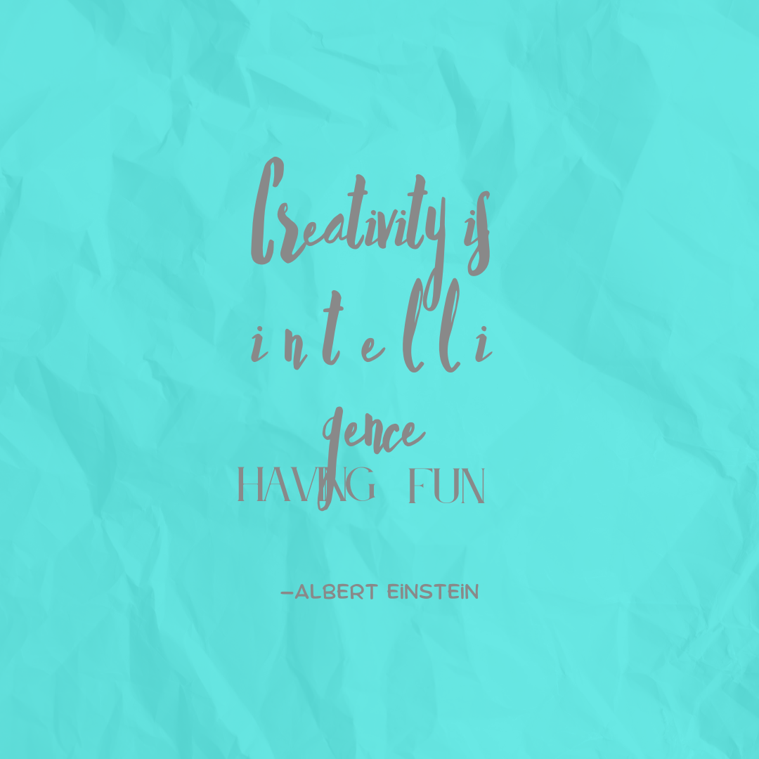 The words “Creativity is intelligence having fun — Albert Einstein” in a pale gray script over a textured bright-blue background.
