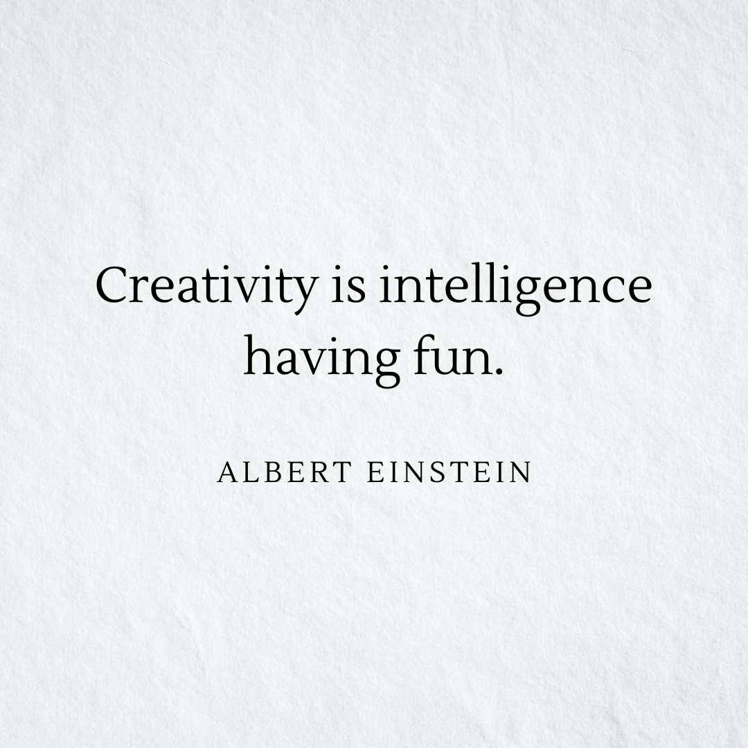 The words “Creativity is intelligence having fun — Albert Einstein” in a black serif font over a lightly textured off-white background.