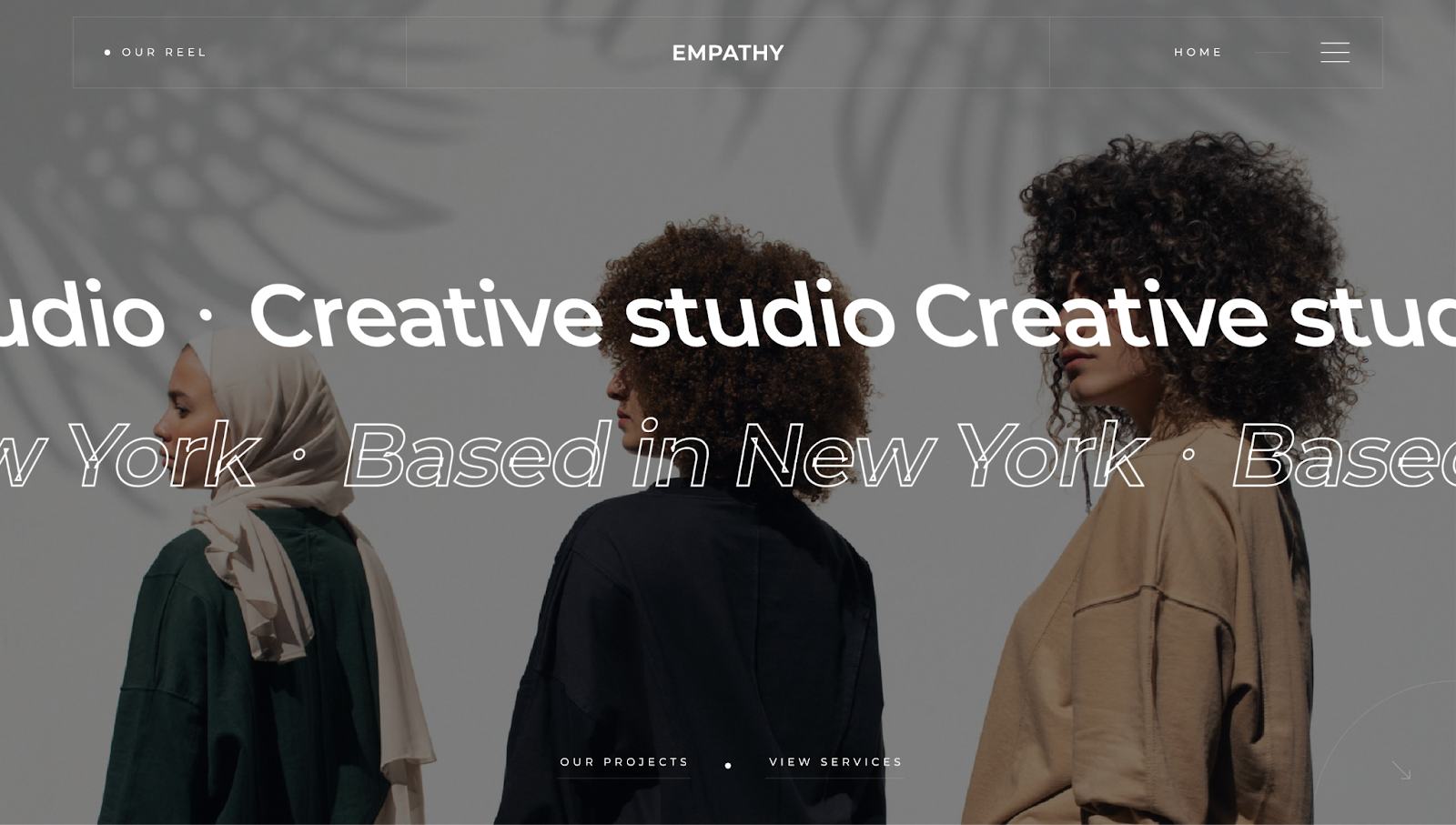 The Empathy web design portfolio template shows three people walking with the words “Creative studio” and “Based in New York” across the page.