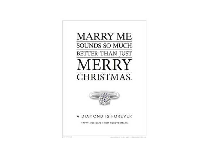 Photo of a magazine advertisement featuring a diamond ring and the headline “Marry me sounds so much better than just Merry Christmas,” with “A diamond is forever” as the subheadline.