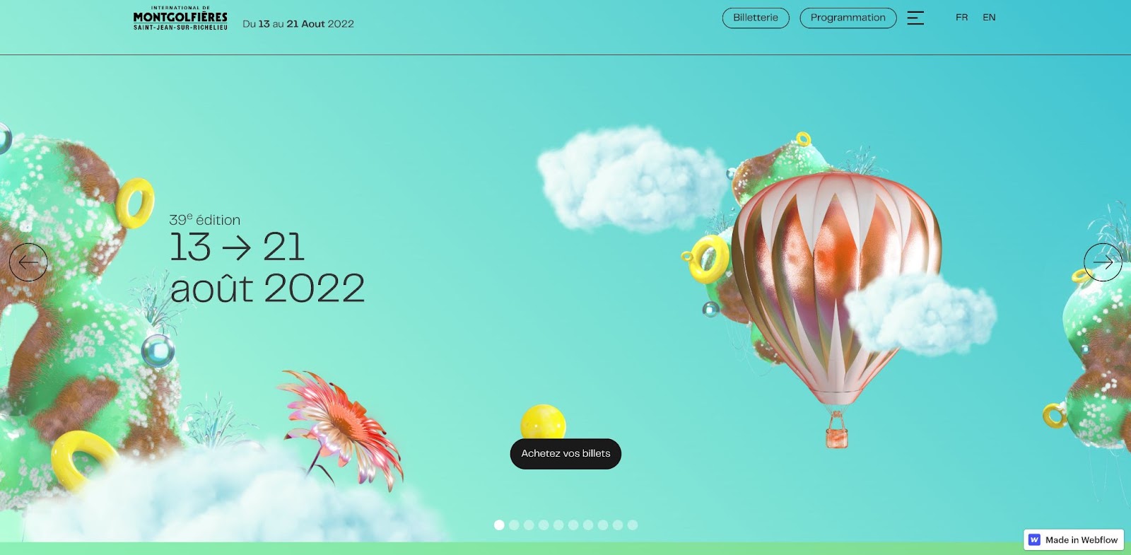 An image of the International de Montgolfière website. It features the date prominently along with illustrations of hot air balloons on a teal background.