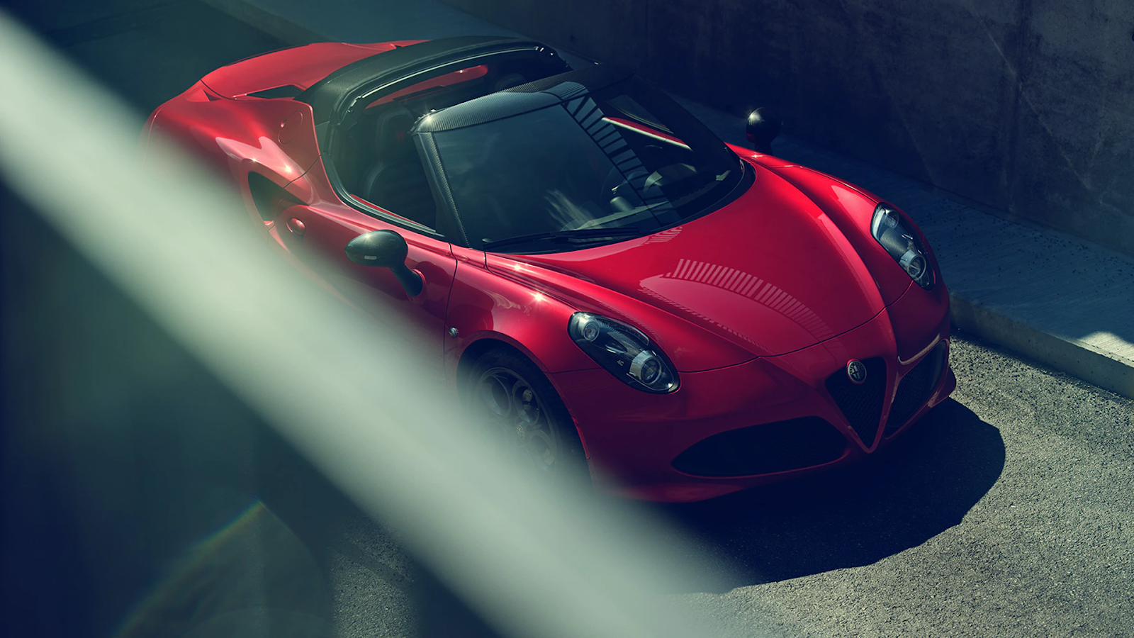 A 3D rendered red convertible car created by the Cinema 4D tool