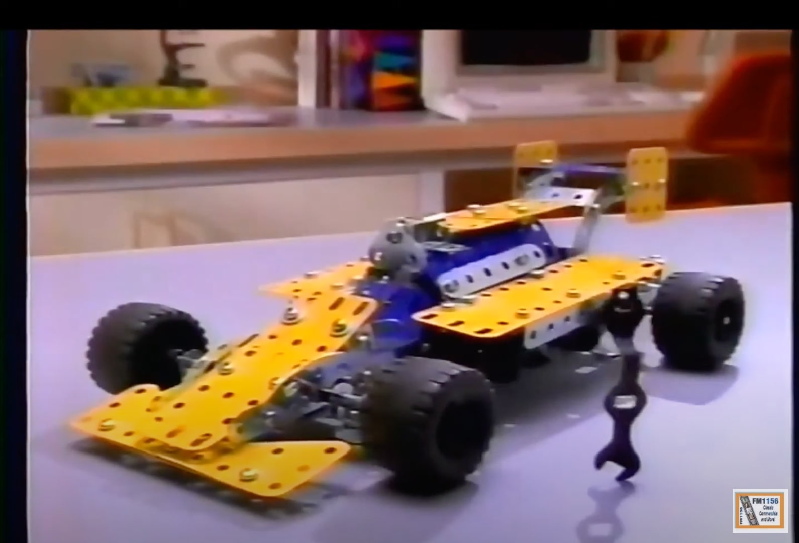 An image of a car built from an erector set.