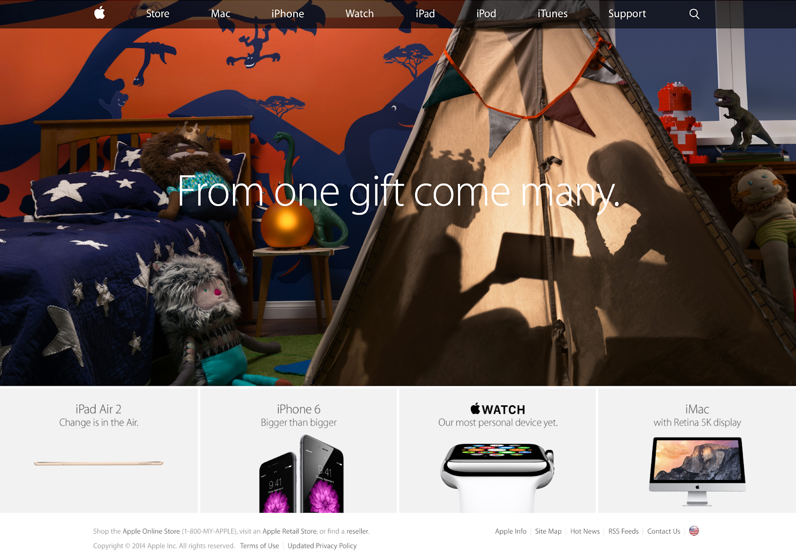 The Apple homepage in 2014, with a brand-new site navigation menu that's both flat and slightly transparent. The hero image is a full bleed image of a child's bedroom with a ten and children presumably watching a movie on an iPa in the tent. The hero text reads: "From one gift come many."