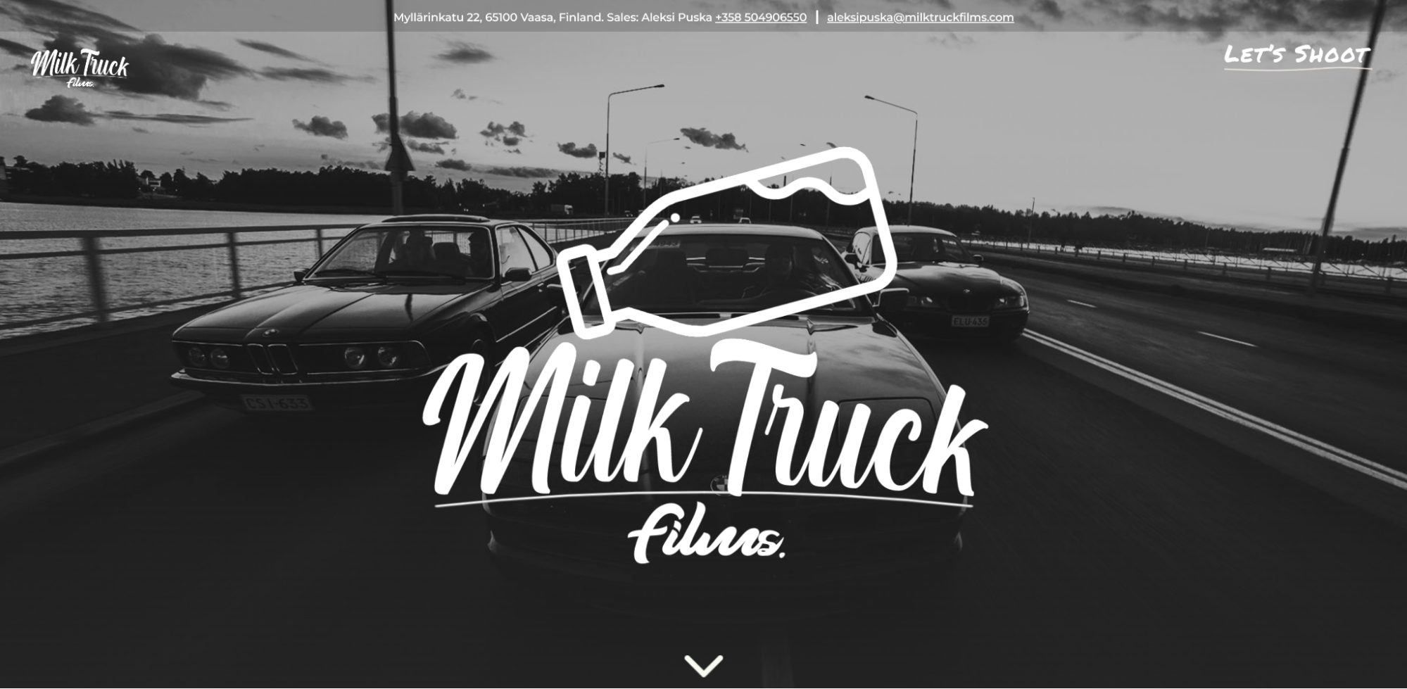 A screenshot of Milk Truck films’ website with a black and white image of cars on a highway with white text "Milk Truck films"