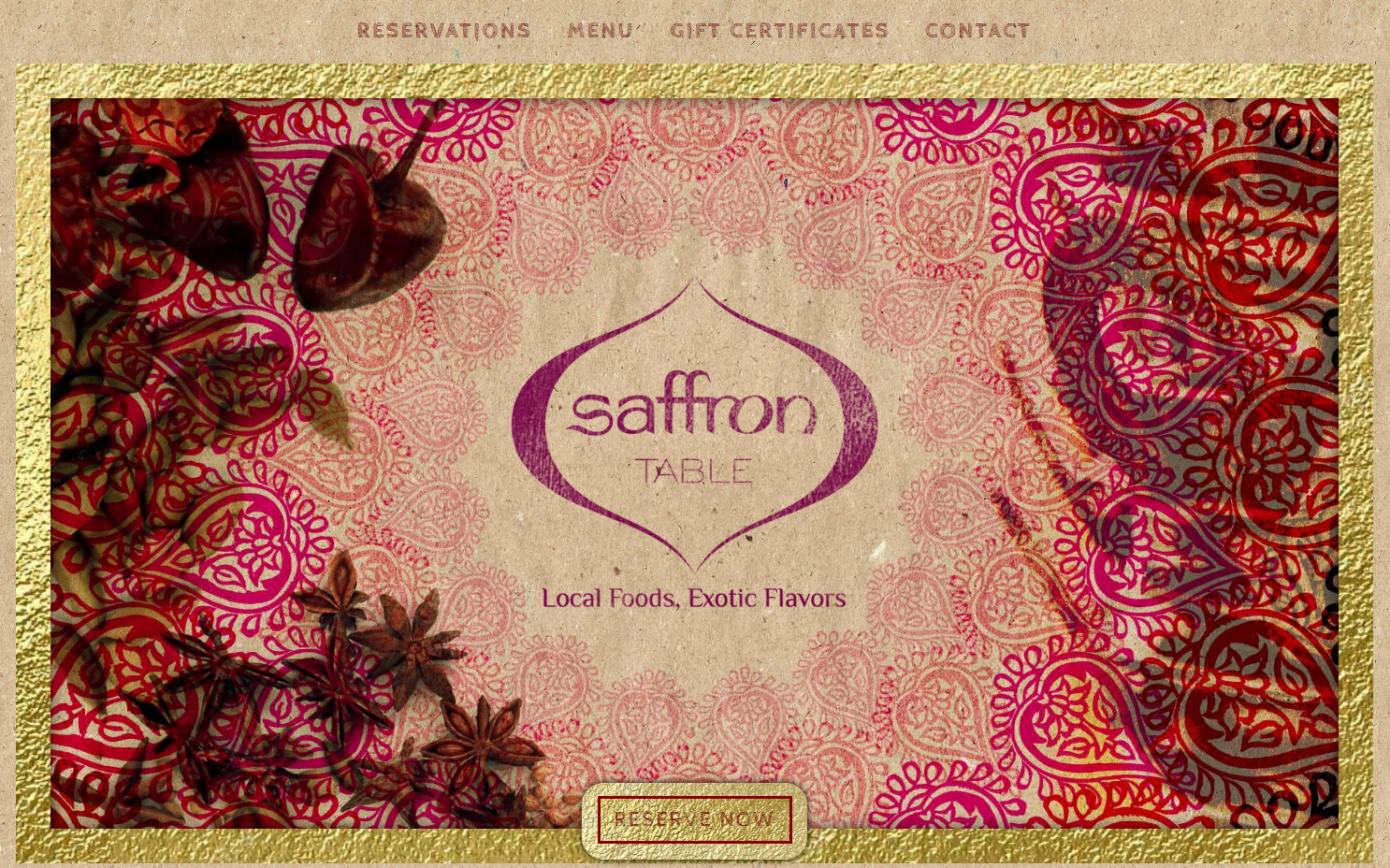 Saffron Table homepage showing the logo against a background of brown paper. A gold paper frame surrounds a drawing of paisley patterns and spices.