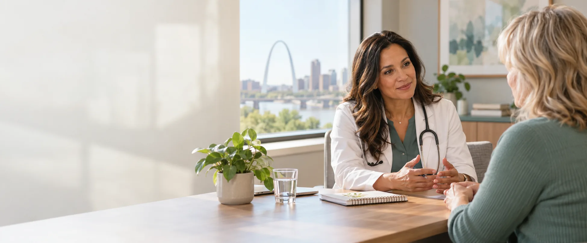 Physician discussing a personalized functional wellness plan with a patient in St. Louis
