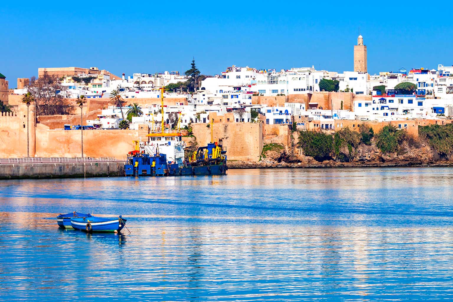 Idyllic Morocco habour scene with beutiful city backdrop